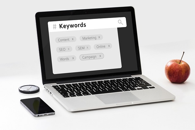Laptop with the term "keywords" at the top with smaller keywords displayed underneath.